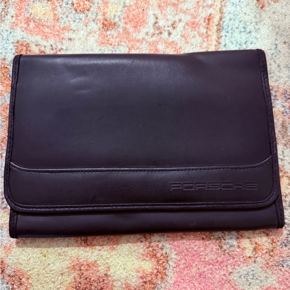 Black Leather case for a Porsche owner’s manual navigation quick reference case
